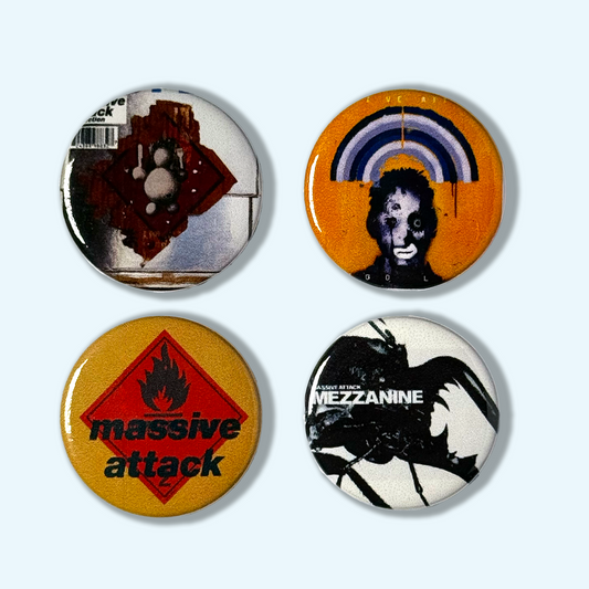 Four buttons featuring artwork and text related to Massive Attack music album covers on a white background.
