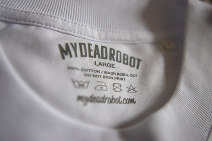 Close-up of a 'My Dead Robot' label on a shirt with washing instructions.