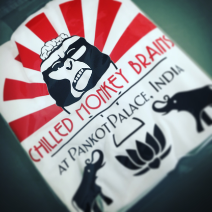 Product packaging with a logo of a monkey and text 'Chilled Monkey Brains' on a red and white background.