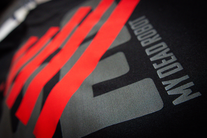 Black t-shirt with red blocky heart and grey "LOVE" text on a dark background